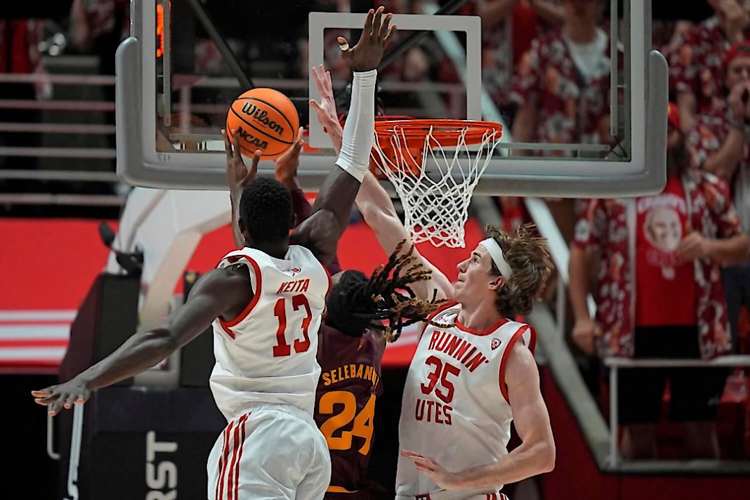 Utah NCAAB players trying to stop a basket