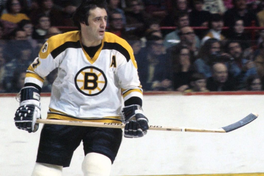 An old photo of Phil Esposito cruising across the ice during a game