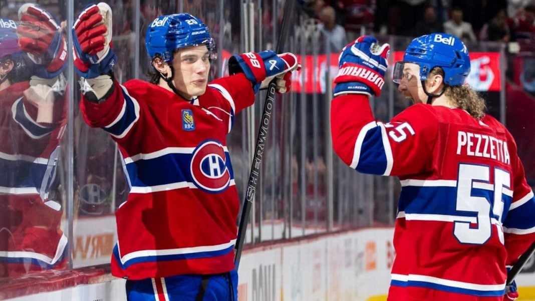 Michael Pezzetta celebrates with his Montreal Canadiens teammate on the ice