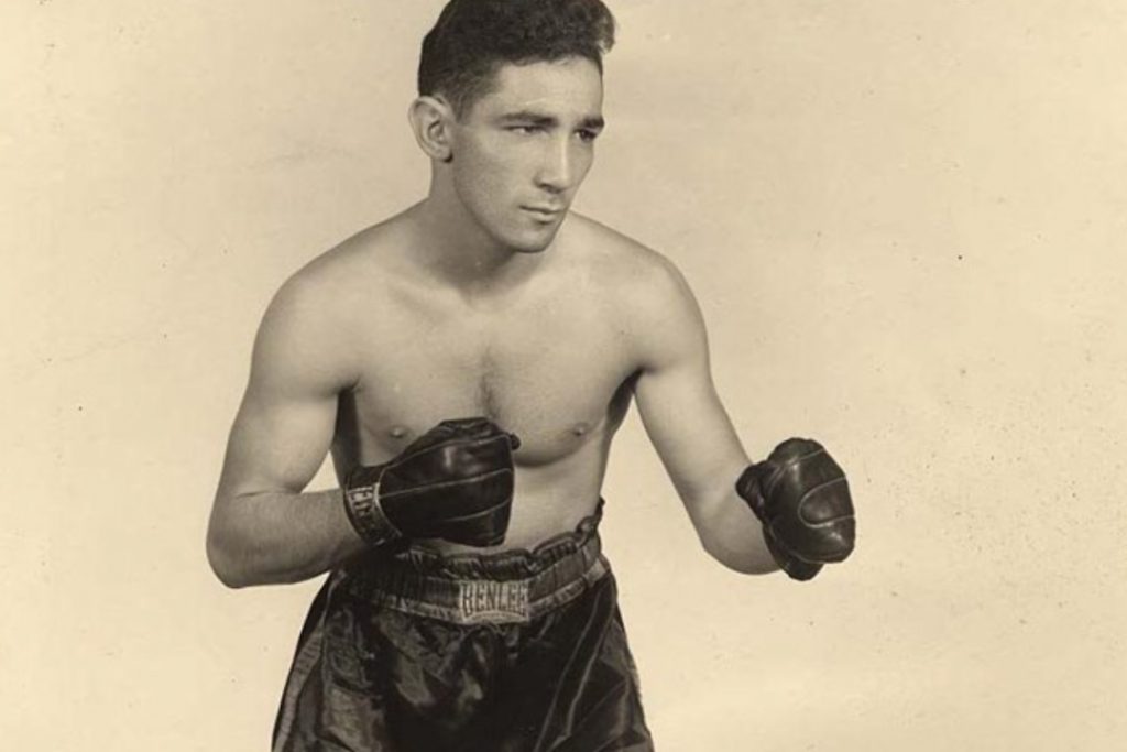 Willie Pep posing for a photo