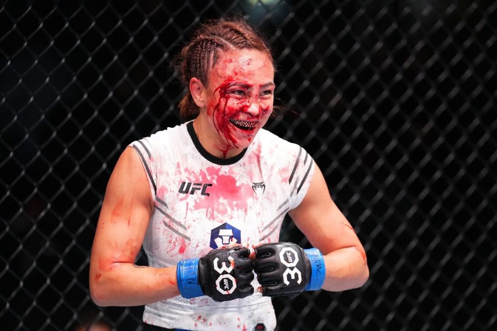 A scary-looking Michelle Waterson-Gomez covered in blood