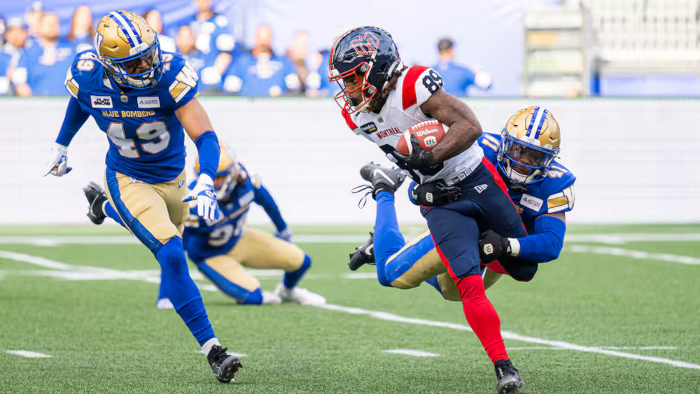 James Letcher Jr. breaks a tackle for the Montreal Alouettes