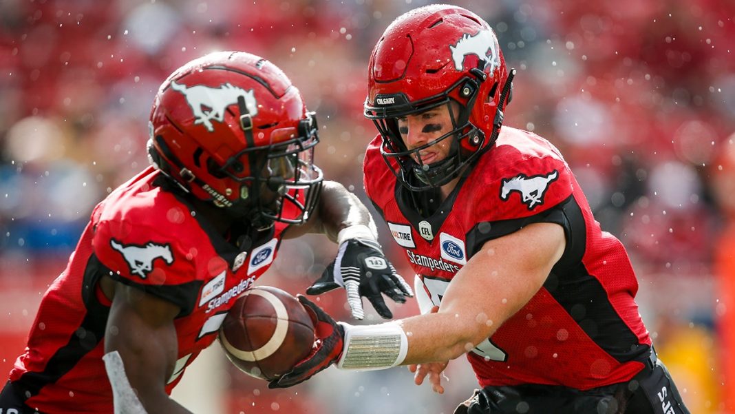 Calgary Stampeders players passing after the snap