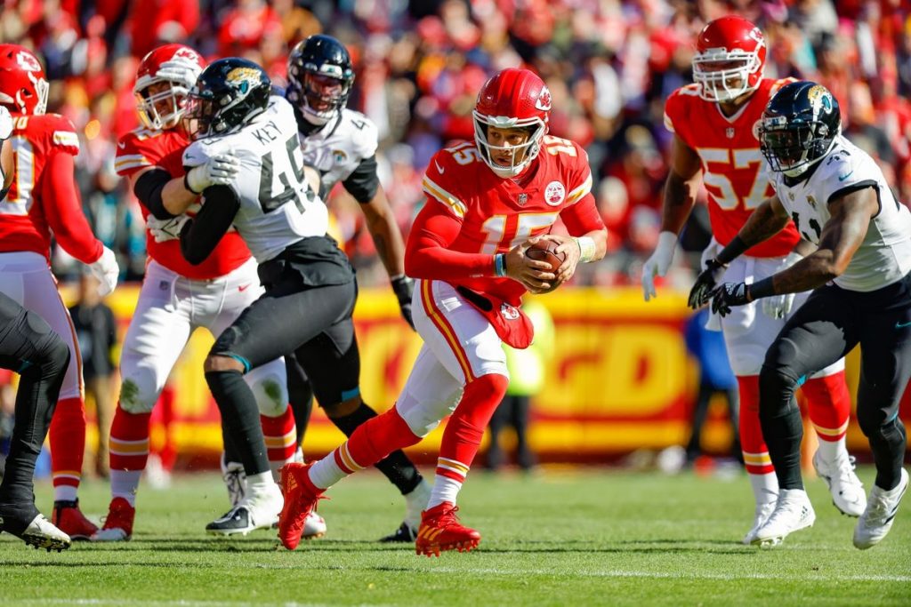 Kansas City football player holding the ball