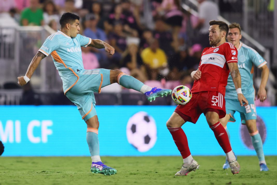 Luis Suarez strikes the ball.