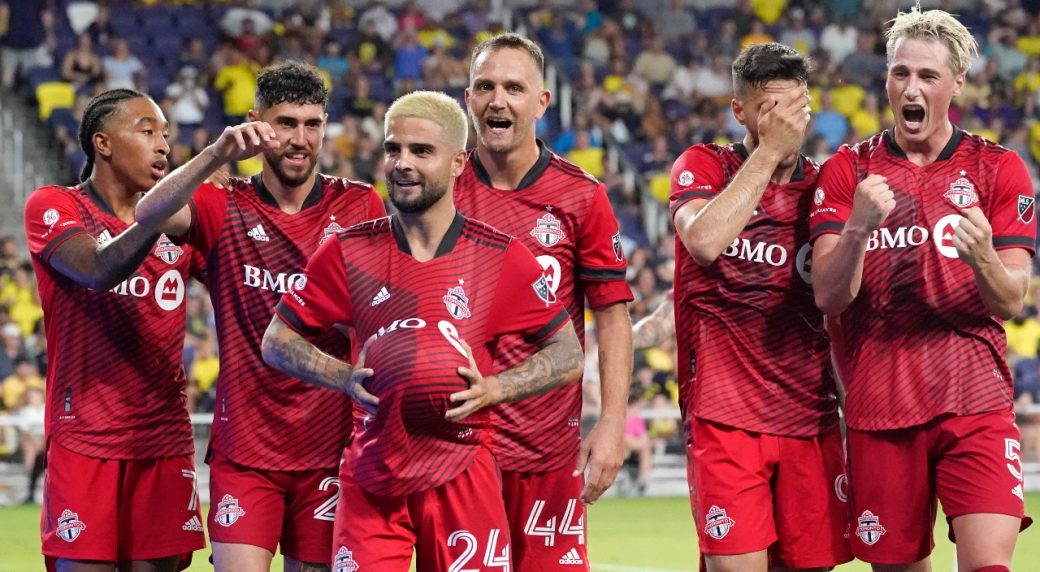 Lorenzo Insigne celebrates with his Toronto FC teammates.