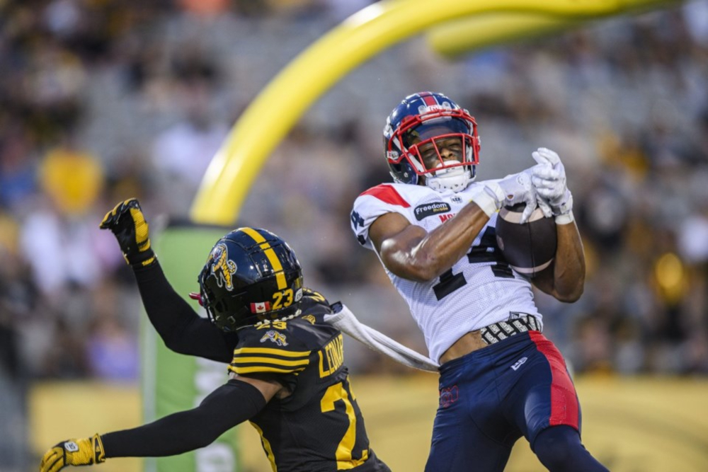 A Montreal player catching a pass against the Hamilton Tiger-Cats